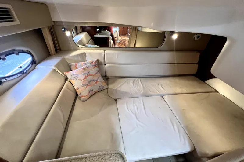 Slide: The Image of Interior of 2006 Regal Commodore 3560 IB yacht with beige seating and decorative pillow. - 77