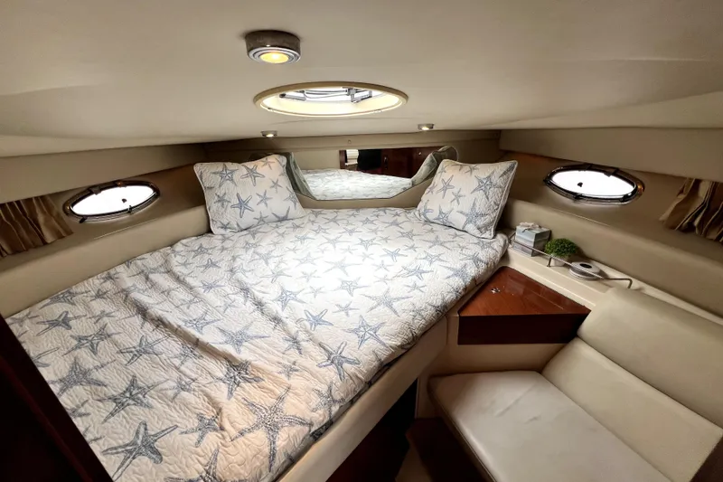 Slide: The Image of Luxurious cabin interior of 2006 Regal Commodore 3560 IB yacht with starfish bedding. - 35