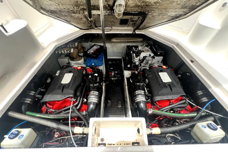 Slide: The Image of Engine compartment of a 2006 Regal Commodore 3560 IB boat, showcasing dual engines. - 66