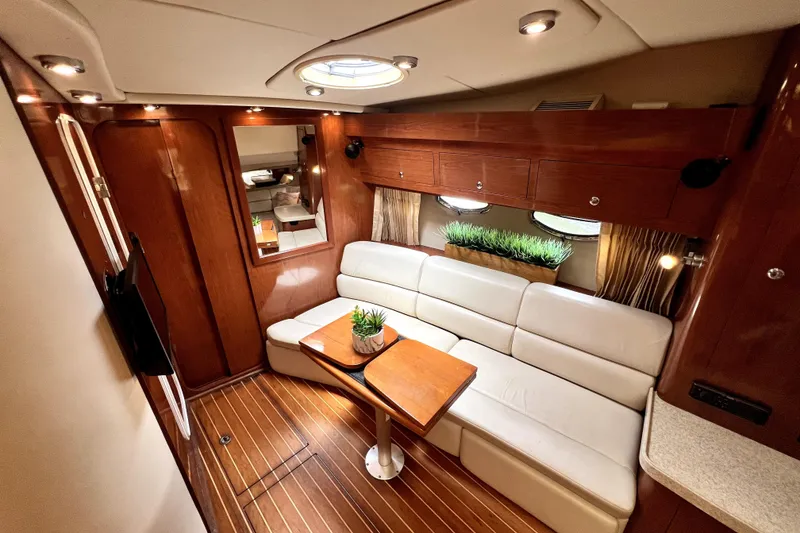 Slide: The Image of Luxurious interior of 2006 Regal Commodore 3560 IB yacht with elegant seating and wooden finishes. - 33