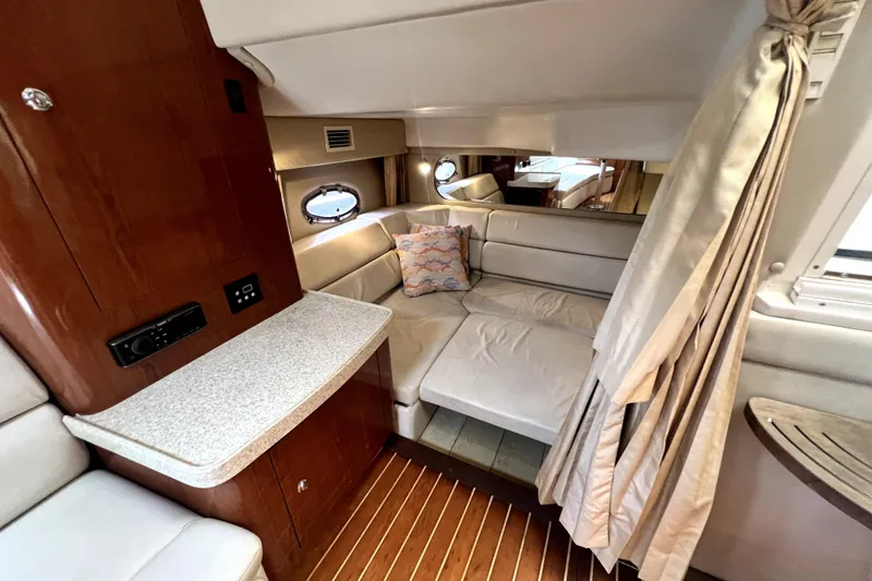 Slide: The Image of Interior of 2006 Regal Commodore 3560 IB yacht with cozy seating and elegant wood finishes. - 78