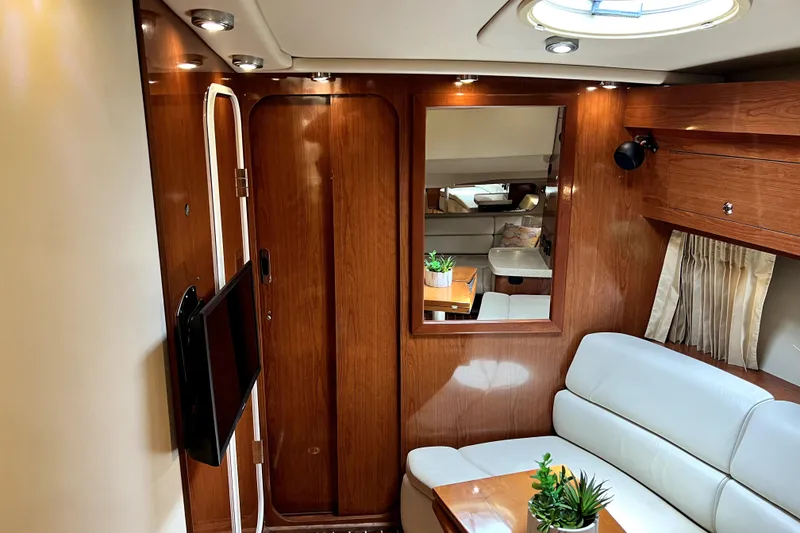 Slide: The Image of Luxurious interior of 2006 Regal Commodore 3560 IB yacht with wood paneling and plush seating. - 31