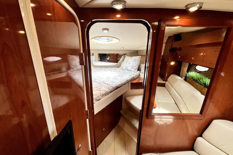 Slide: The Image of Luxurious interior of 2006 Regal Commodore 3560 IB yacht with cozy bed and seating area. - 27