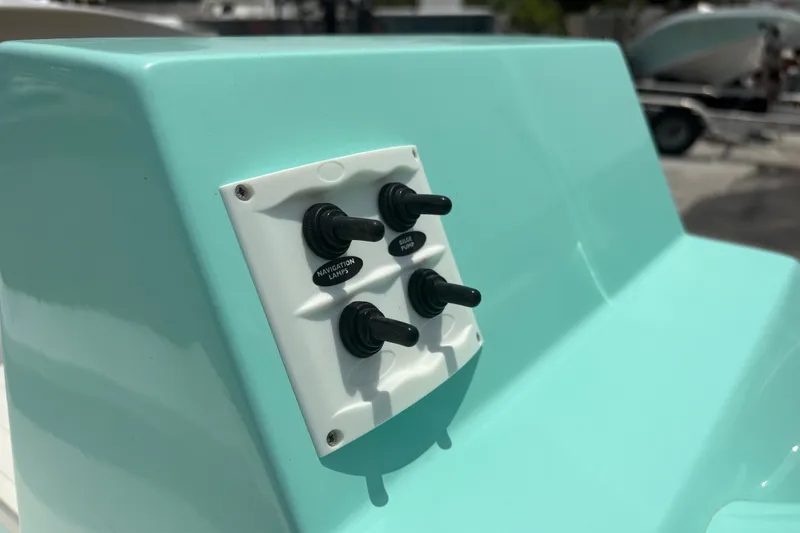 Slide: The Image of Control panel on Exuma 14 Snookaholic boat, featuring toggle switches, 2025 model. - 21
