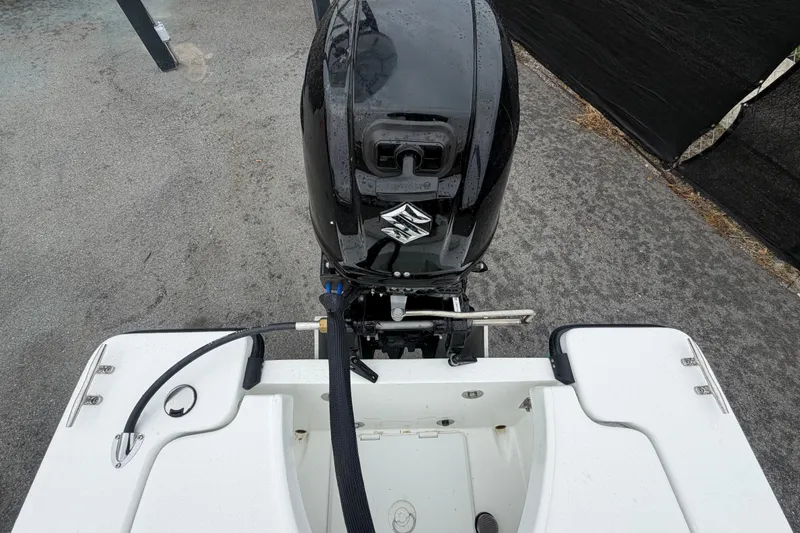 Slide: The Image of Rear view of 2025 Exuma 14 Snookaholic boat with Suzuki outboard motor. - 52