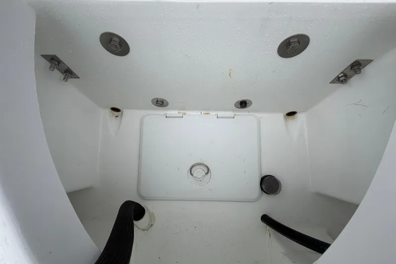 Slide: The Image of Interior view of Exuma 14 Snookaholic boat compartment, showcasing drainage and fittings, 2025 model. - 50
