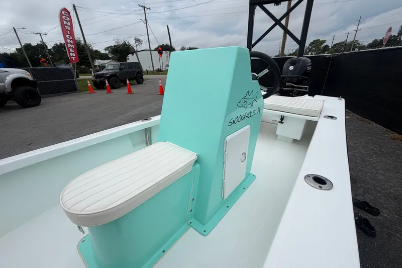 Slide: The Image of 2025 Exuma 14 Snookaholic boat with mint green console and white seating. - 37