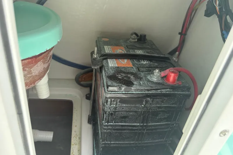 Slide: The Image of Battery compartment of 2025 Exuma 14 Snookaholic boat, showing wiring and connections. - 22