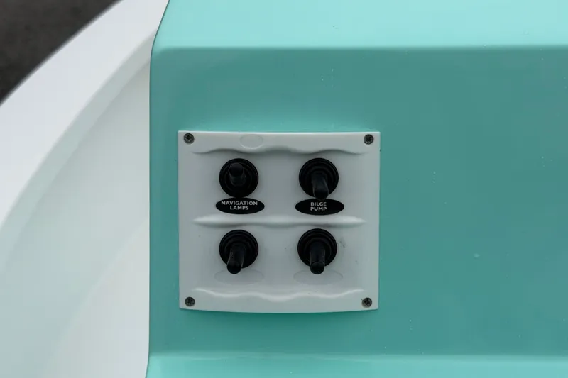 Slide: The Image of Control panel on 2025 Exuma 14 Snookaholic boat with navigation lamps and bilge pump switches. - 17