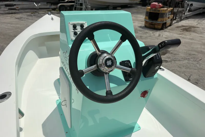Slide: The Image of Steering console of 2025 Exuma 14 Snookaholic boat, featuring a sleek design. - 20