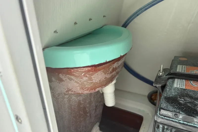 Slide: The Image of Exuma 14 Snookaholic 2025 boat component with turquoise cover and battery connection. - 18