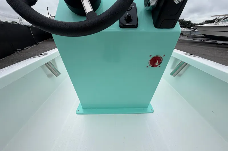 Slide: The Image of 2025 Exuma 14 Snookaholic boat interior with steering wheel and control panel. - 21
