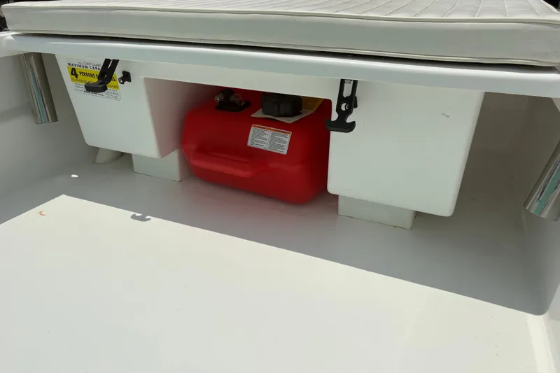 Slide: The Image of Storage compartment of 2025 Exuma 14 Snookaholic boat with red fuel tank. - 19