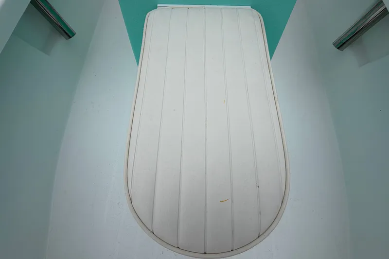 Slide: The Image of Interior view of 2025 Exuma 14 Snookaholic boat, featuring a sleek white deck. - 34