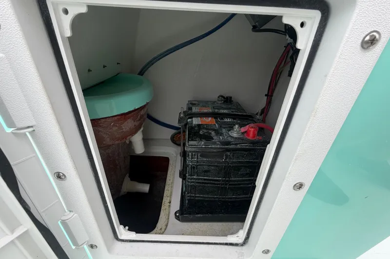 Slide: The Image of Battery compartment of 2025 Exuma 14 Snookaholic boat, featuring wiring and plumbing. - 40