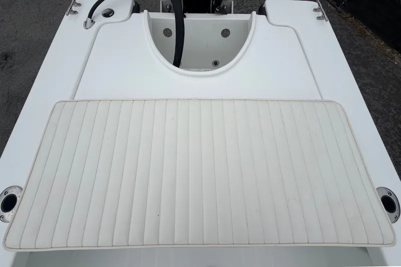 Slide: The Image of The image shows the deck of a 2025 Exuma 14 Snookaholic boat with a padded mat. - 48