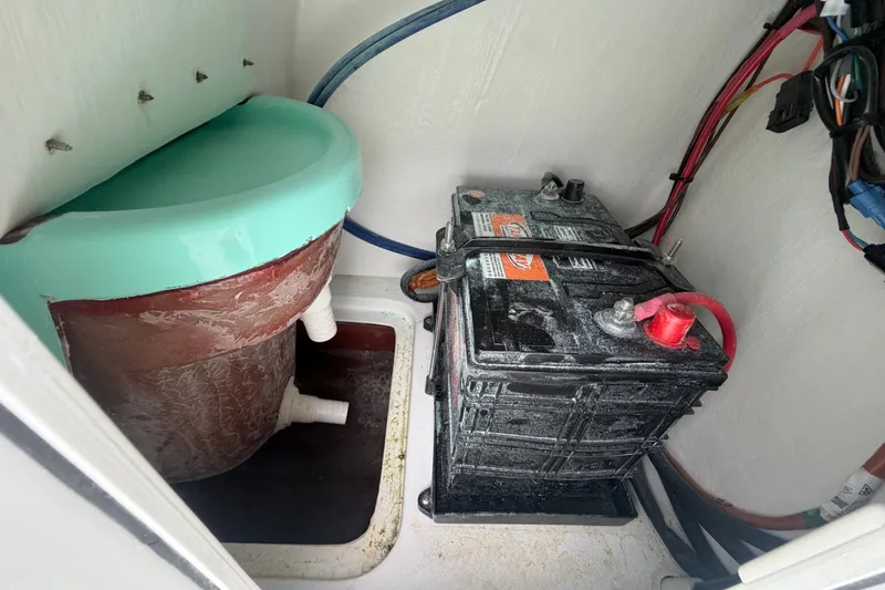 Slide: The Image of Battery and filter system inside 2025 Exuma 14 Snookaholic boat compartment. - 42
