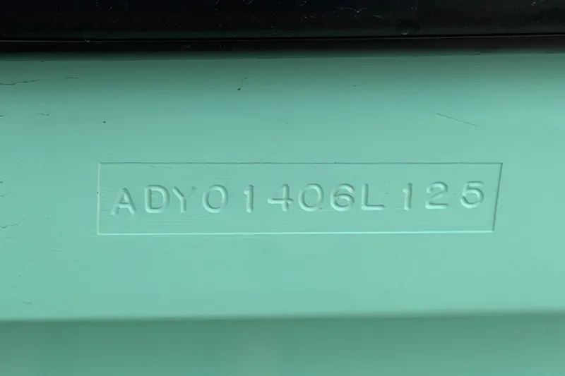 Slide: The Image of Hull identification number on 2025 Exuma 14 Snookaholic boat. - 54