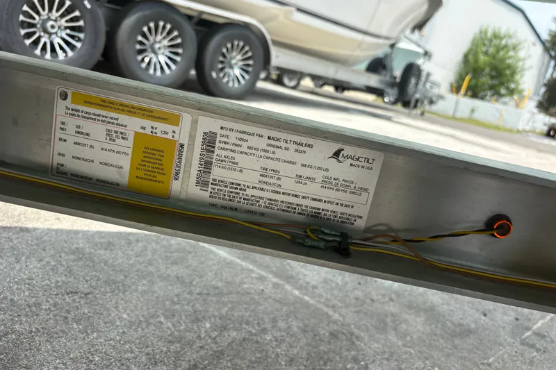 Slide: The Image of Trailer label with specifications for Exuma 14 Snookaholic 2025 model, featuring tire and loading information. - 30