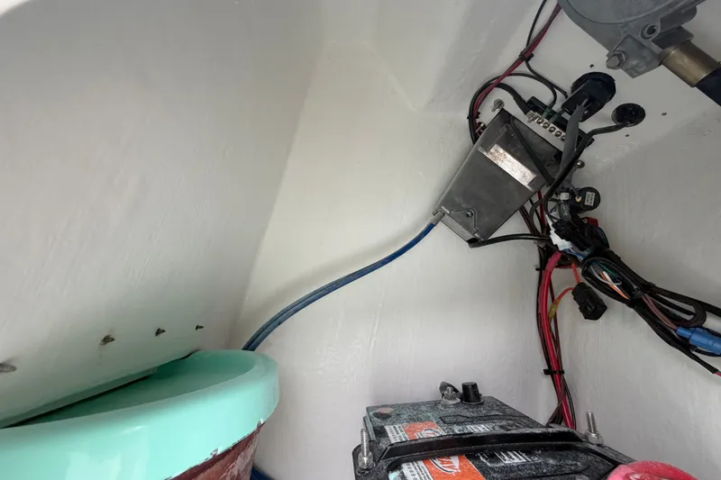 Slide: The Image of Interior view of 2025 Exuma 14 Snookaholic boat showing wiring and battery setup. - 41