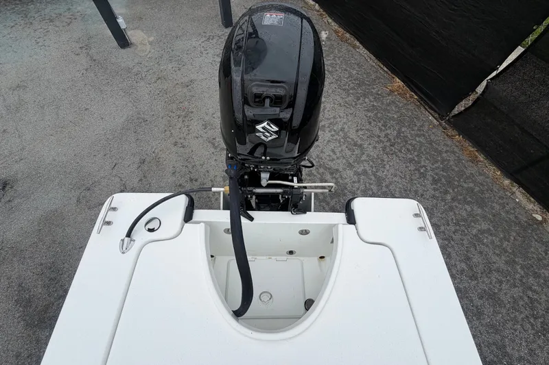 Slide: The Image of The image shows the engine of a 2025 Exuma 14 Snookaholic boat. - 49