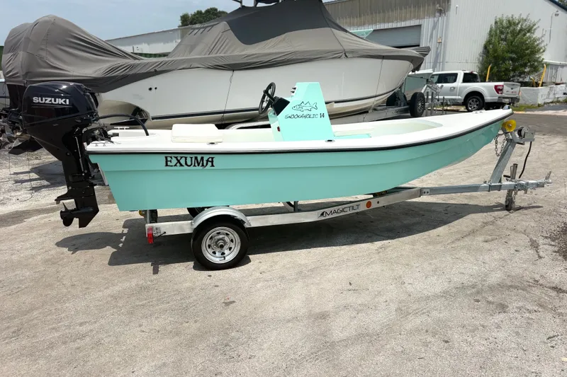 The Image of 2025 Exuma 14 Snookaholic boat on trailer, featuring Suzuki outboard motor. - 0