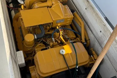 Slide: The Image of Yellow engine of a 1999 Markley 46 Chesapeake boat, detailed view. - 8