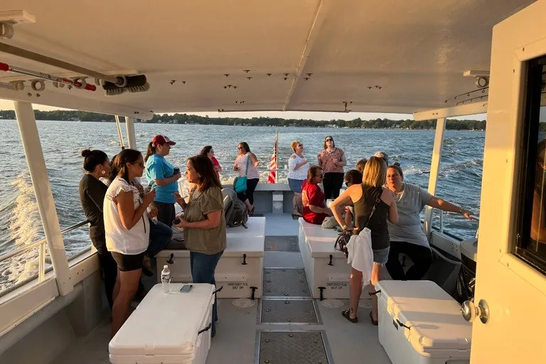 Slide: The Image of Group enjoying a boat ride on a 1999 Markley 46 Chesapeake. - 3