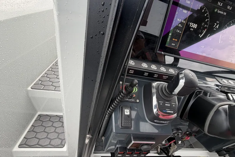 Slide: The Image of Control panel of 2023 XO DFNDR 9 boat with joystick and digital display. - 6