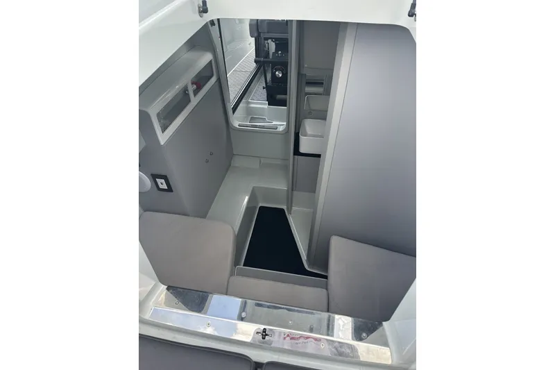 Slide: The Image of Interior view of 2023 XO DFNDR 9 boat, showcasing sleek, modern cabin design. - 19