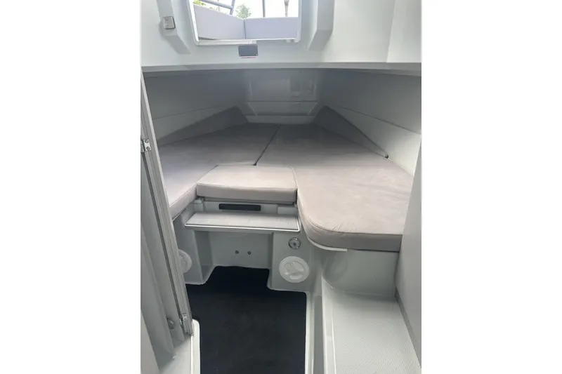 Slide: The Image of 2023 XO DFNDR 9 cabin interior with cushioned seating and modern design. - 18