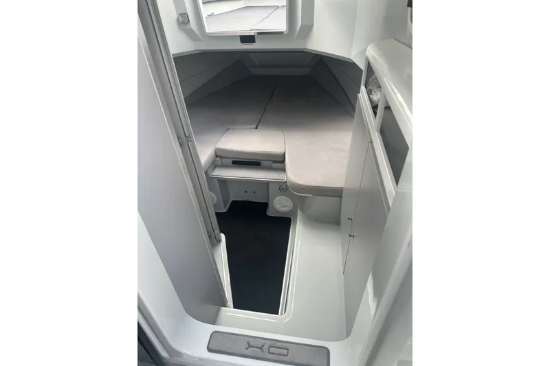 Slide: The Image of Interior cabin of 2023 XO DFNDR 9 boat, featuring sleek design and modern amenities. - 17