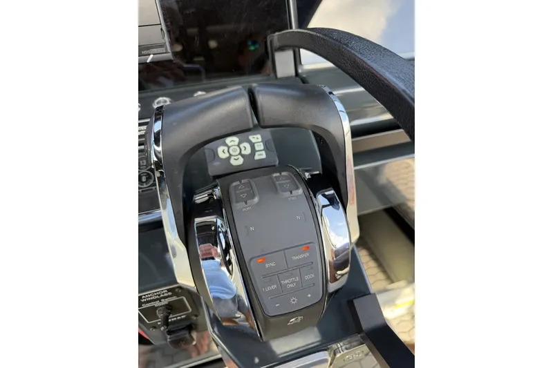 Slide: The Image of Control panel of 2023 XO DFNDR 9 boat, featuring modern navigation controls. - 16