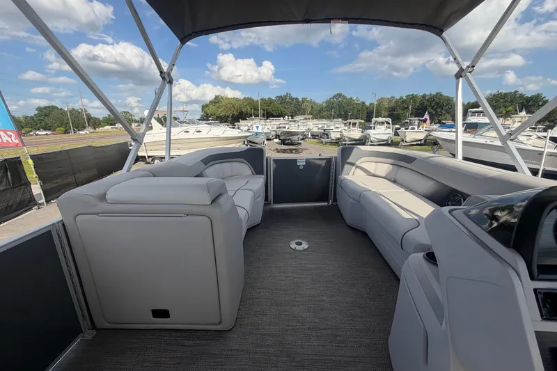 Slide: The Image of 2025 Godfrey Sweetwater 2286 SFL pontoon boat interior with spacious seating and canopy. - 41