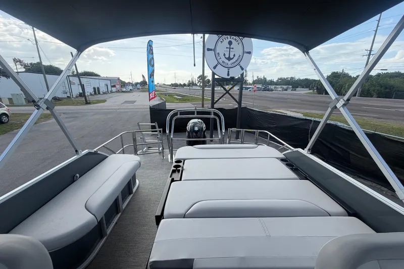 Slide: The Image of 2025 Godfrey Sweetwater 2286 SFL pontoon boat interior with seating and canopy. - 18