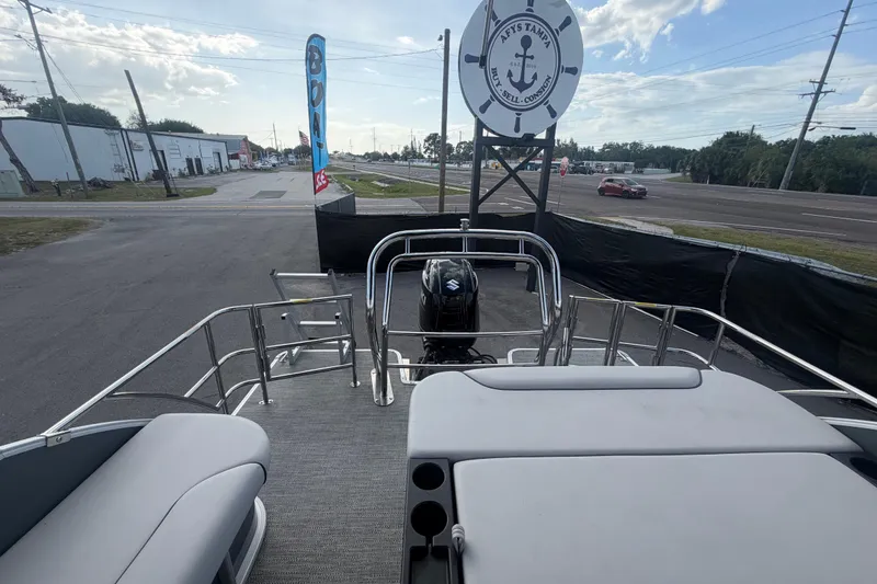 Slide: The Image of 2025 Godfrey Sweetwater 2286 SFL pontoon boat displayed at a dealership. - 19