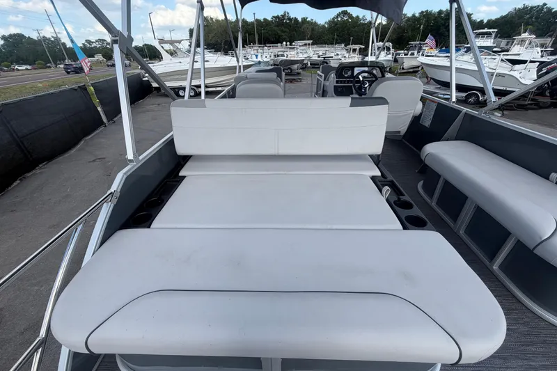 Slide: The Image of 2025 Godfrey Sweetwater 2286 SFL pontoon boat with spacious seating and modern design. - 29