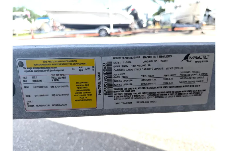 Slide: The Image of Label on Magic Tilt trailer with tire and loading information, 2025 Godfrey Sweetwater 2286 SFL. - 54
