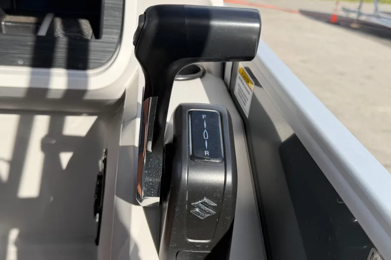 Slide: The Image of Throttle control lever on a 2025 Godfrey Sweetwater 2286 SFL boat. - 38