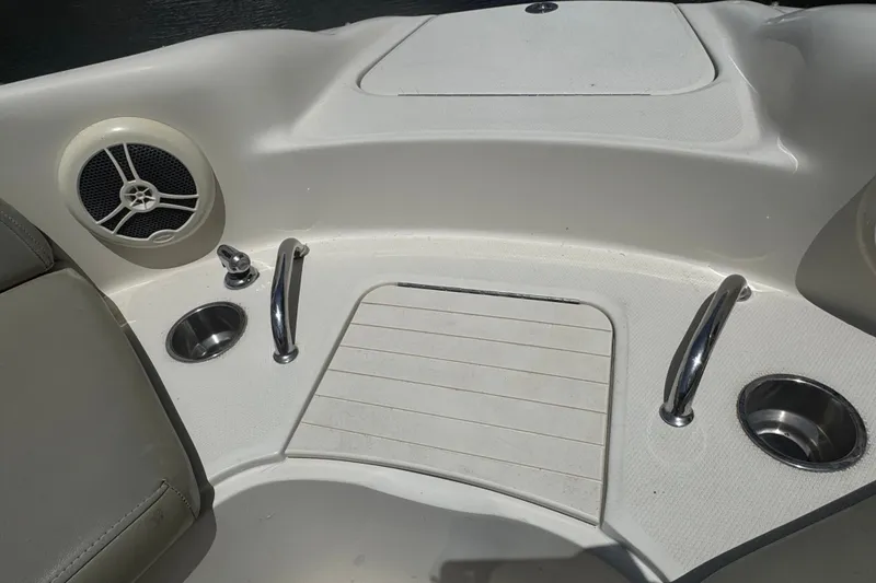 Slide: The Image of Interior of 2006 Sea Ray 240 Sundeck boat with speaker and cup holders. - 4