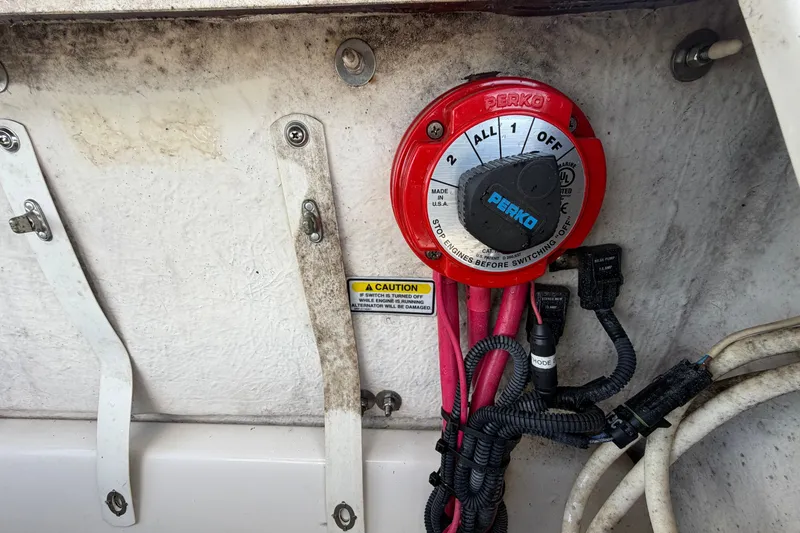 Slide: The Image of Battery switch on a 2006 Sea Ray 250 Amberjack boat with wiring connections. - 16