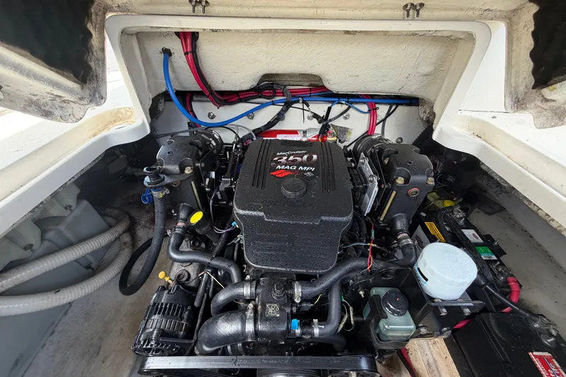 Slide: The Image of Engine compartment of a 2006 Sea Ray 250 Amberjack boat, featuring a MerCruiser 350 MAG MPI engine. - 61