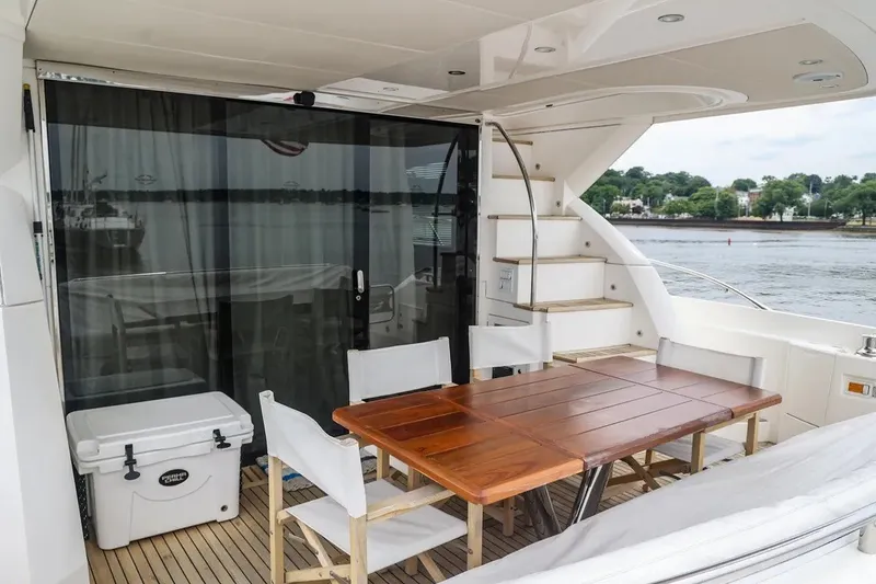 Slide: The Image of Luxurious Sunseeker Manhattan 65 yacht deck with dining area, 2016 model. - 25