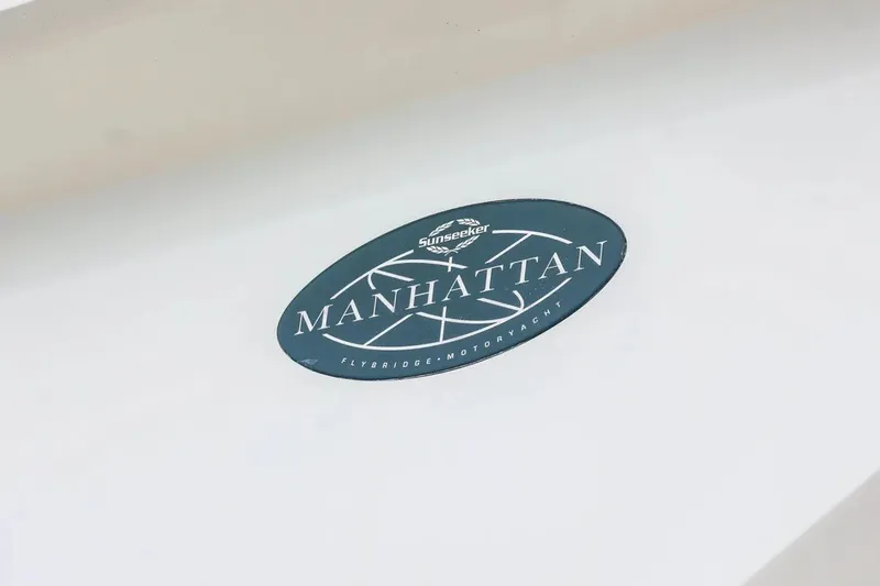 Slide: The Image of 2016 Sunseeker Manhattan 65 yacht logo on white surface. - 26