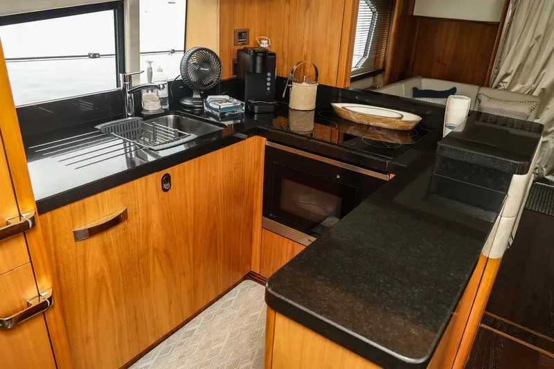 Slide: The Image of Luxurious kitchen interior of 2016 Sunseeker Manhattan 65 yacht with modern amenities. - 14
