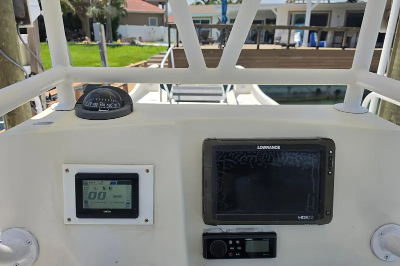Slide: The Image of Cockpit of 2014 Custom Exuma Catamaran 32 with navigation instruments and controls. - 18