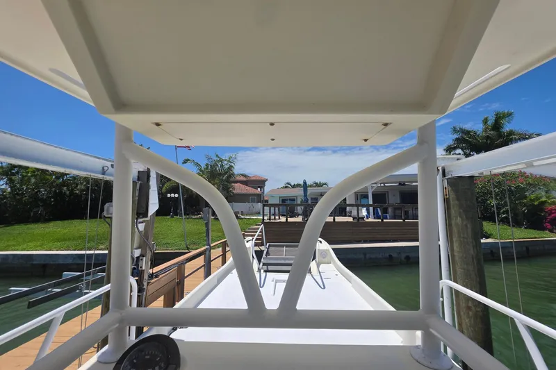 Slide: The Image of View from the deck of a 2014 Custom Exuma Catamaran 32 at a dock. - 22