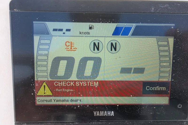 Slide: The Image of Yamaha display showing system check alert for 2014 Custom Exuma Catamaran 32. - 20