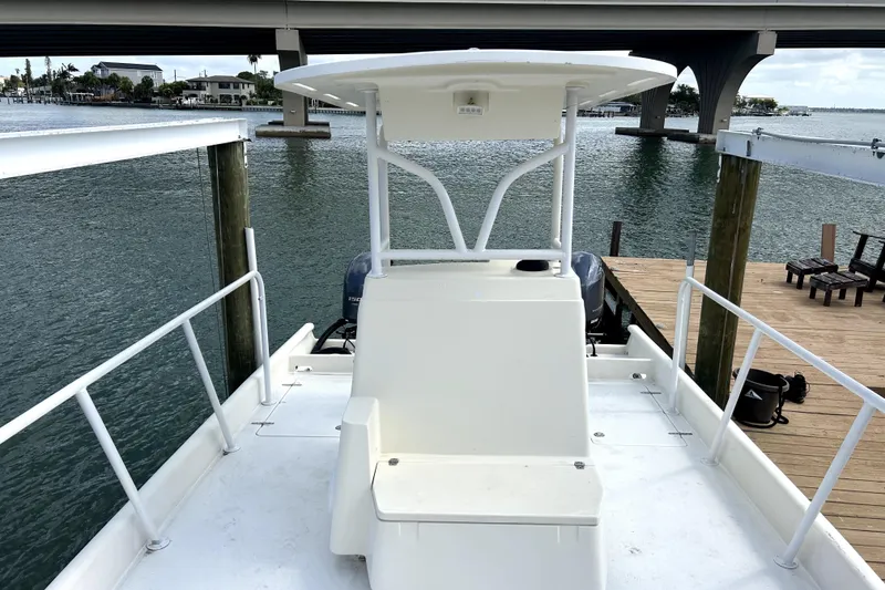 Slide: The Image of 2014 Custom Exuma Catamaran 32 docked by waterfront under bridge. - 33