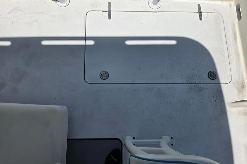 Slide: The Image of Deck view of a 2014 Custom Exuma Catamaran 32, featuring seating and storage hatch. - 59